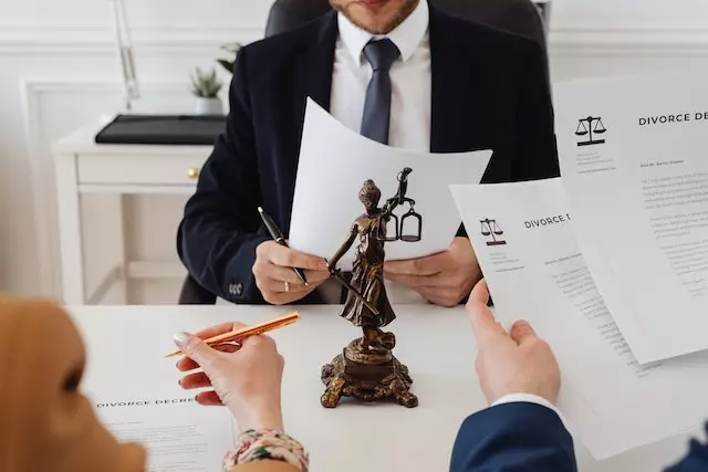 Divorce Lawyer holding a document