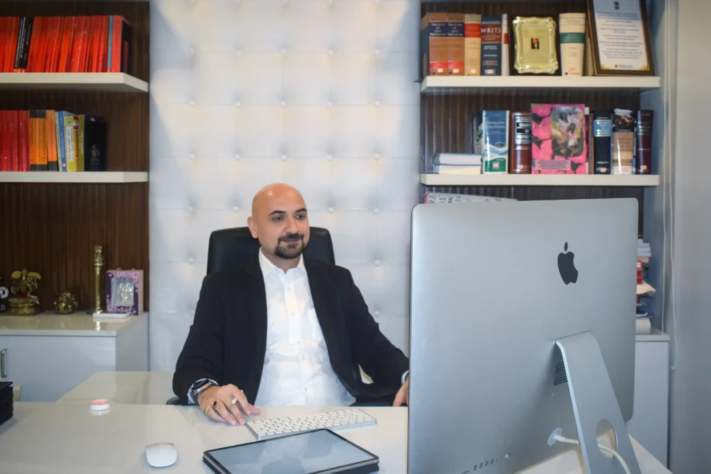 Lawyer at Kapil Dixit LLP on iMac during online legal consultation, Bangalore
